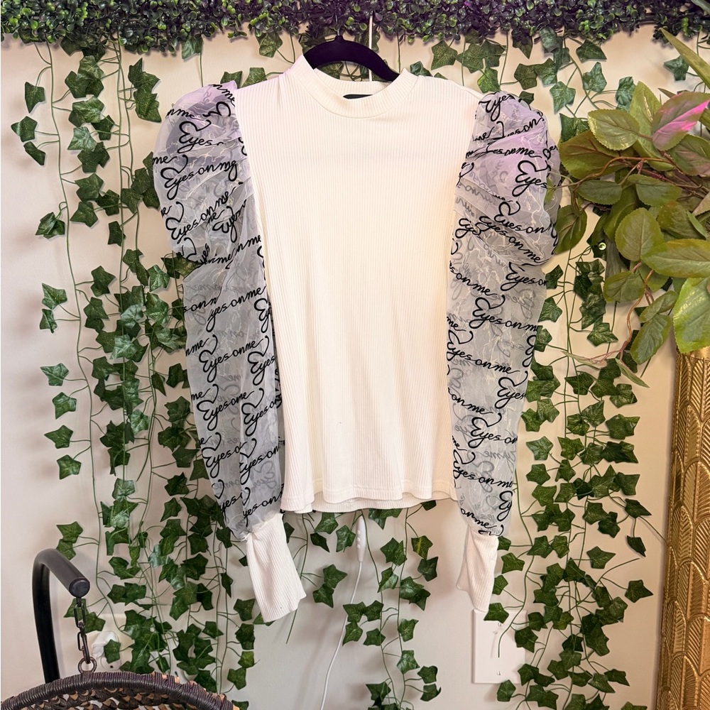 AKIRA White Top with Black Script Sheer Sleeves